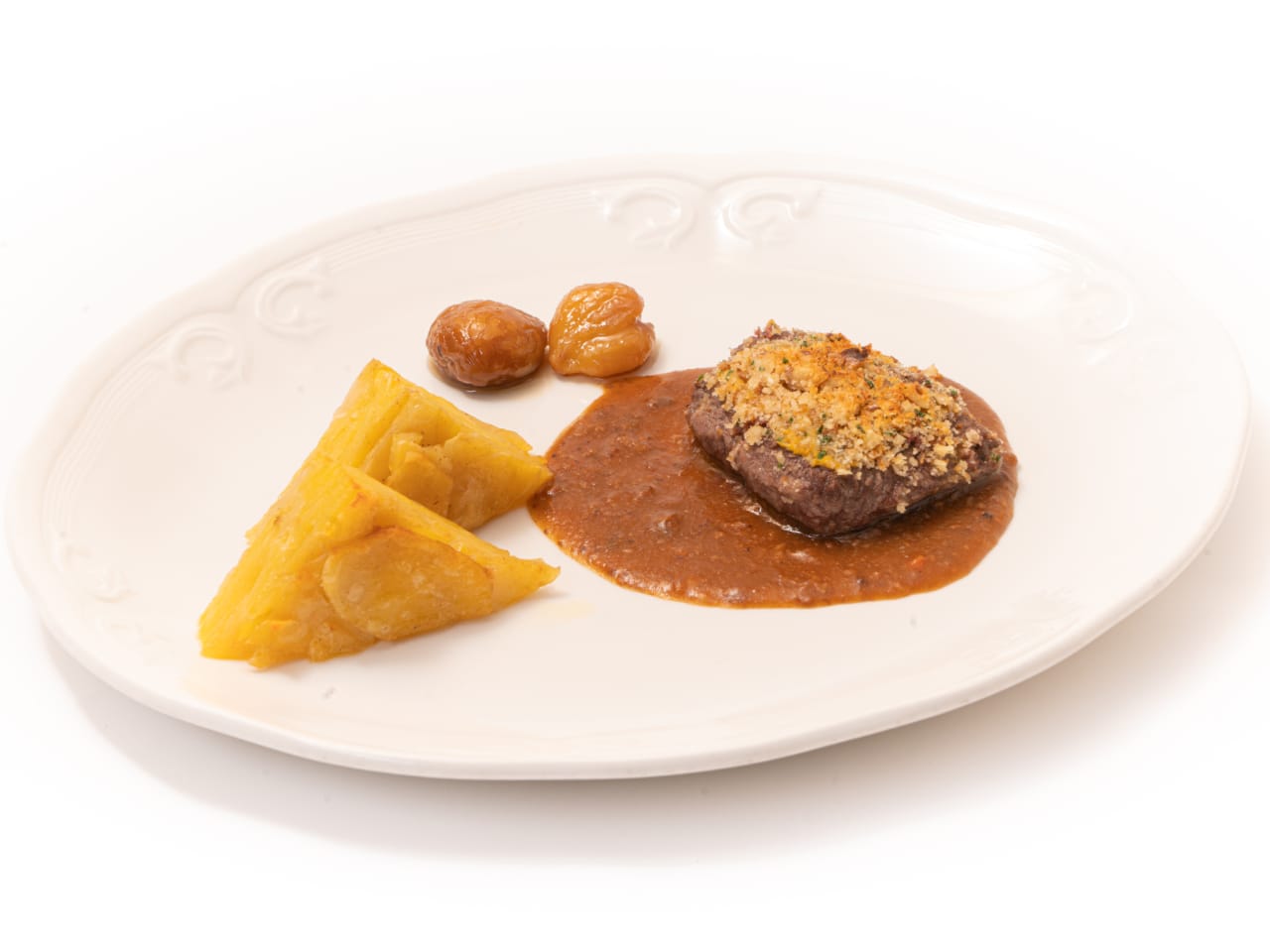 Medaglioni di camoscio in crosta di noci e patate fondenti con salsa di castagne e morchelle